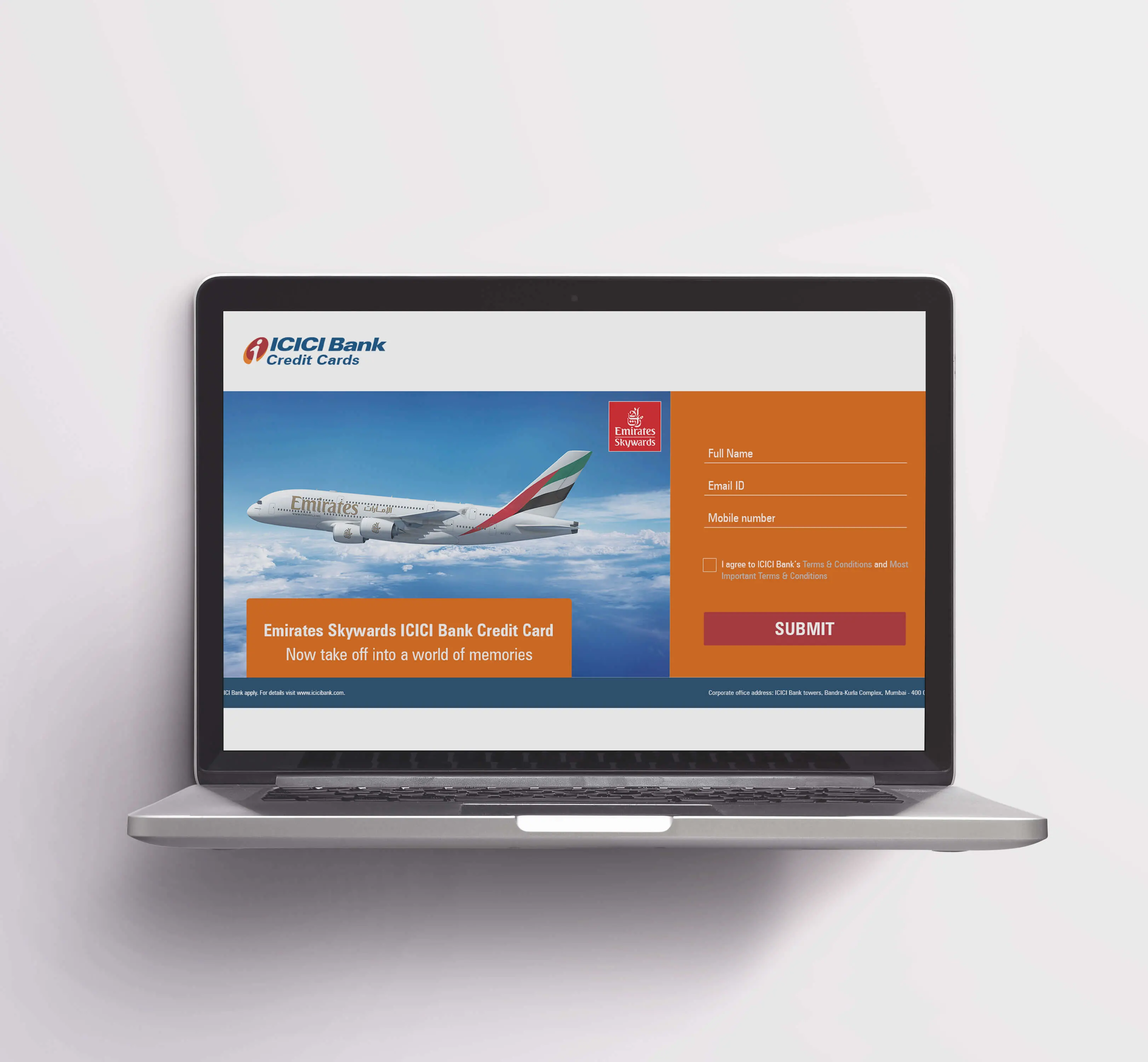 A laptop displays a promotional webpage for the Emirates Skywards ICICI Bank Credit Card, featuring an Emirates airplane and a form to apply.